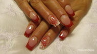 Red and white nails with snowflakes